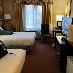 Room with 2 queens, small refrigerator and microwave