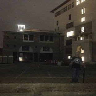 a man standing in front of a building