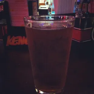 a glass of beer on a table
