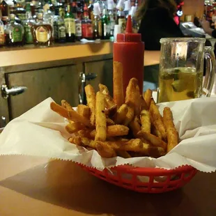 Some seasoned fries and 2 dollar tecates