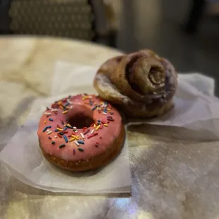 Pink Sprinkled donut and Cinnamon Roll