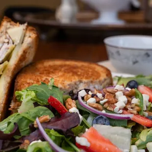 a plate of salad and a sandwich
