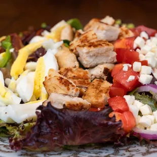 a salad with chicken and vegetables