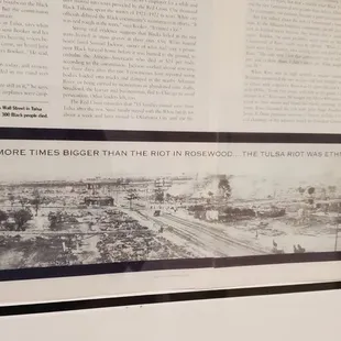 Framed displays on the walls about the Tulsa Race Massacre