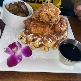 chicken and waffles with a side of home fries