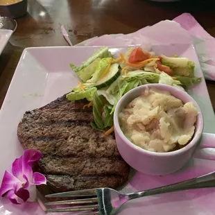 Sirloin with garden salad and garlic mashed potatoes.