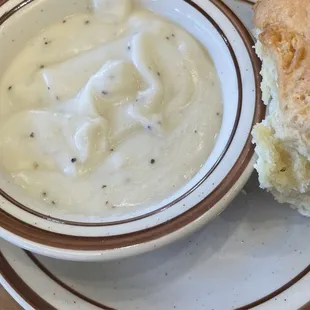 a bowl of soup and a biscuit