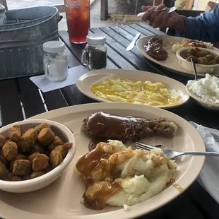 Salisbury steak special with mashed potatoes and fried okra, side Over easy eggs, and side cottage cheese.