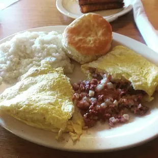 Cornbread hash omelette with grits and a biscut.