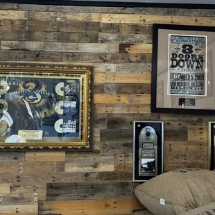  wooden wall with posters on it