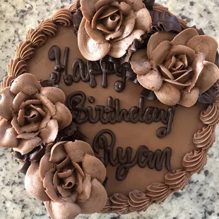 Two layer chocolate cake with chocolate filling and chocolate frosting.