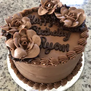 Two layer chocolate cake with chocolate filling and chocolate frosting