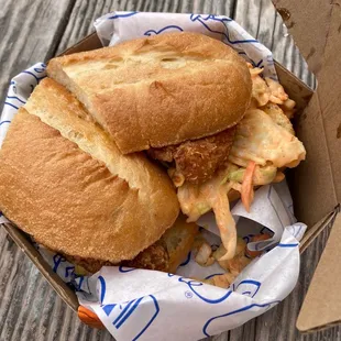 Fried buttermilk chicken filet with spicy cole slaw on French roll
