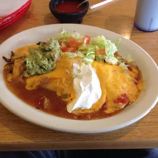 El Burro Martin: shredded beef, smothered in green chili, cheese lettuce tomato, guacamole, sour cream.