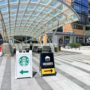 a starbucks sign in front of a building