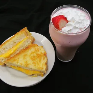 Grilled 3 cheese and hand mixed strawberry milkshake