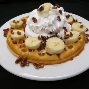Waffle with HEGGY'S pecans, banana and whipped cream.