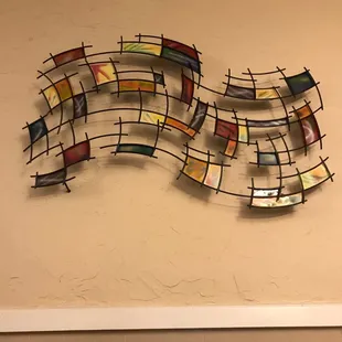 a metal sculpture of a wave