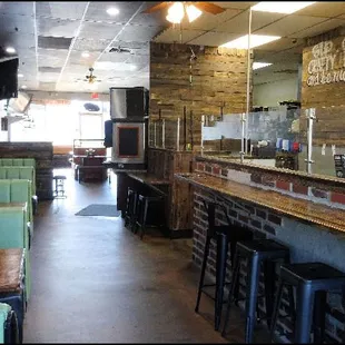 Here&apos;s the main dining room, which is located with the long counter, where you can sit and watch the pizza chef create your masterpiece.