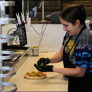 After placing my order of a &quot;Personal Size Pizza,&quot; chef Gena began to work on my pizza, to my order, and created it, as I watched.