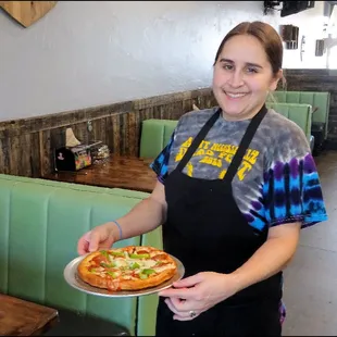 Meet super friendly Gena, the owner and chef of the restaurant, as she brings to me a delicious &quot;Personal&quot; pizza, baked perfectly.
