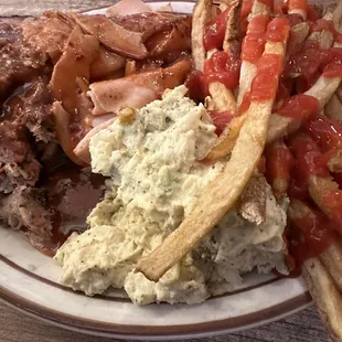 3 meat sampler. Brisket, pulled pork and turkey. With side of fries and potato salad. Delicious!