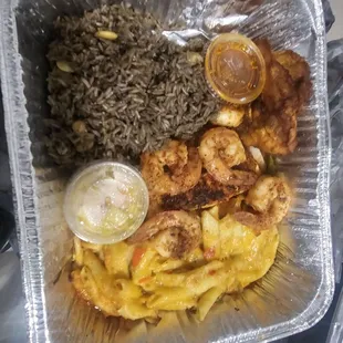 Shrimp and salmon platter with black rice.