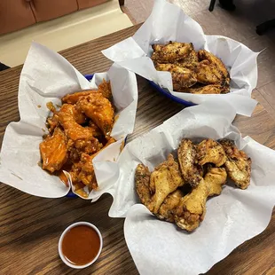 We Three Wings - medium garlic, dry rub lemon pepper and dry rub Cajun with Nashville Hot sauce on the side.