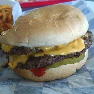 Double cheeseburger with ketchup, mustard, pickle &amp; onion.