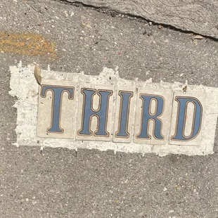 New Orleans does not have street signs. Street names are marked on walkway pavement intersections.
