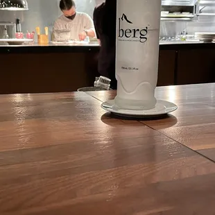 a bottle of beer on a wooden table