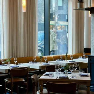 a dining room with a view of the city