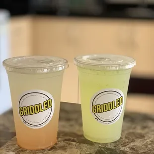 two drinks sitting on a counter
