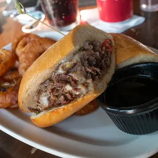 Prime Rib Philly Dip with Onion Rings.
