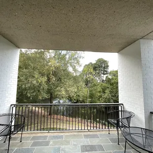 Our balcony view of the pond. It's very spacious and has four  outdoor seats and two tables on each side between the 2 sets of chairs