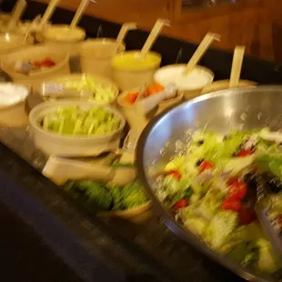a buffet of salads and dips