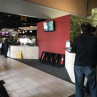 a man standing at the bar