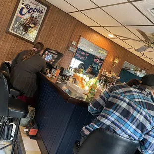 customers sitting at the bar