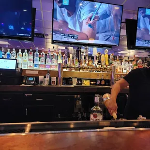 a bartender preparing a drink