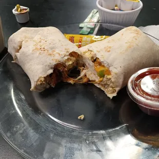 Jerk breakfast burrito.... Jerk chicken, eggs, cheese, peppers &amp; onions...