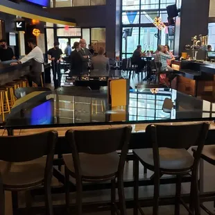 a view of the bar and dining area