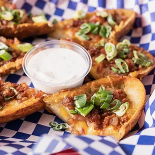 Crispy Loaded Potato Skins. A perfect sidekick to any entree!