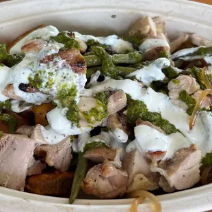 Small bowl with sweet potatoes, noodles, chicken and string beans with two sauces.  Small Bowl