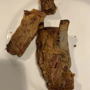Dry hard as rock inedible pork ribs. Embarrassed for them serving this as food.
