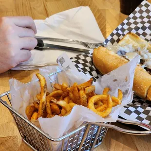 a basket of french fries and a hot dog