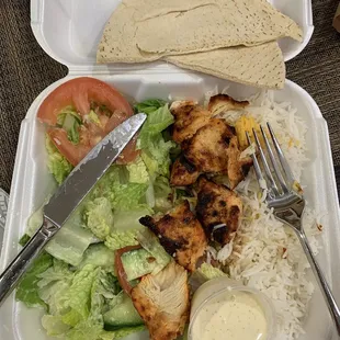 Chicken kabob with rice and salad