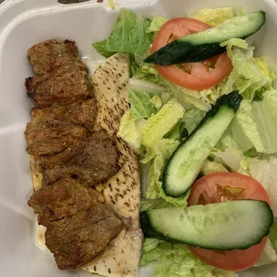Beef kabob with salad