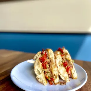 Braised Beef Philly--

Spiced slow roasted beef, roasted garlic aioli, mixed peppers &amp; onion, provolone, garlic baguette