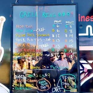 a menu on the side of a food truck
