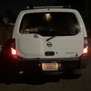 the back end of a white truck